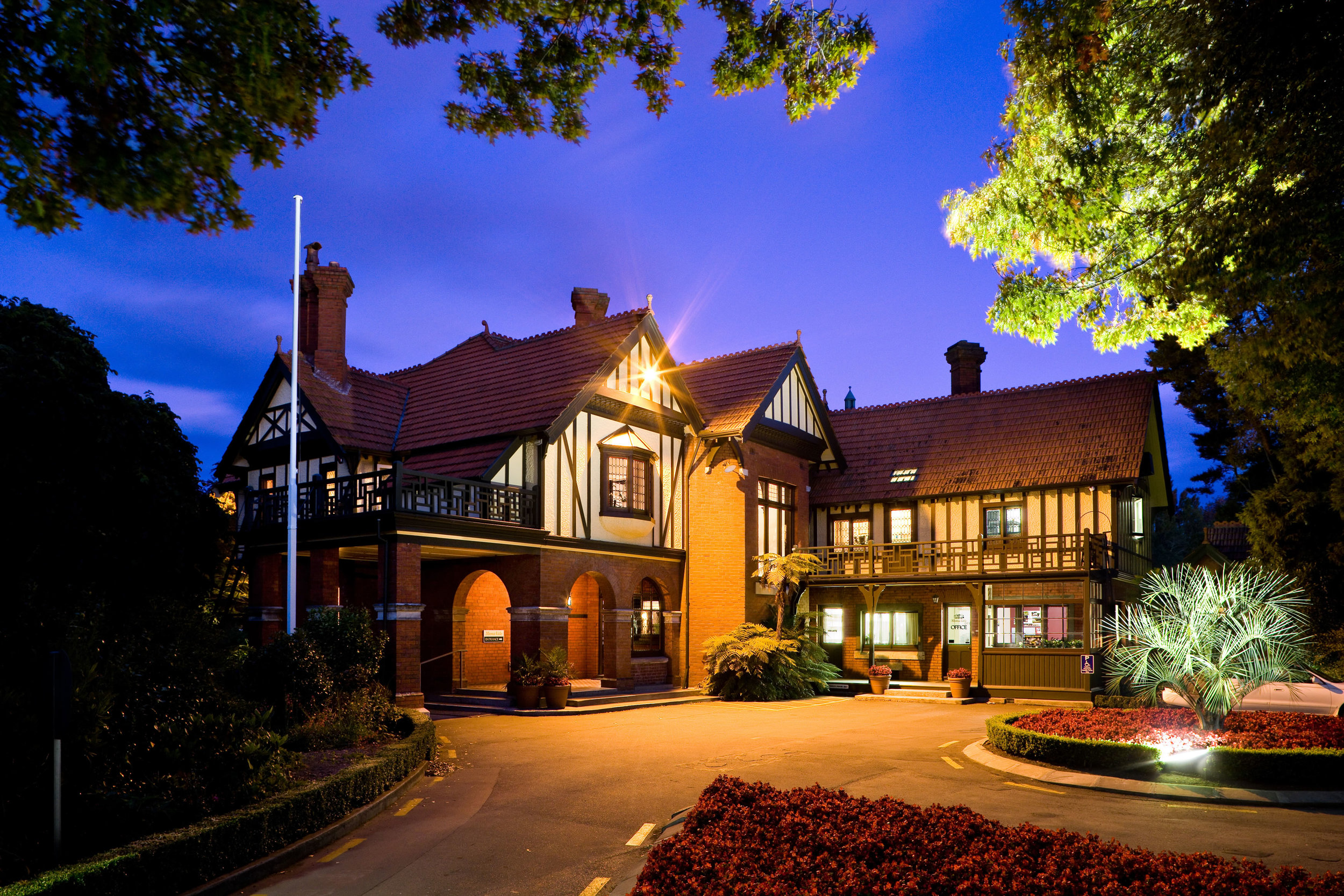 The Mona Vale homestead lit at dusk